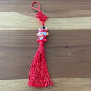 red year of the dragon pendent with tassel